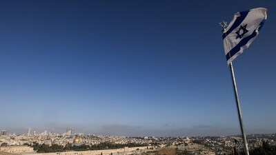 An Israeli flag flies on the Mount of Olives overlooking the Al Aqsa mosque compound and the city skyline in Jerusalem on April 19, 2024. US media quoted officials saying Israel had carried out retaliatory strikes on its arch-rival Iran, while Iran's state media reported explosions in the central province of Isfahan. (AFP) An Israeli flag flies on the Mount of Olives overlooking the Al Aqsa mosque compound and the city skyline in Jerusalem on April 19, 2024. US media quoted officials saying Israel had carried out retaliatory strikes on its arch-rival Iran, while Iran's state media reported explosions in the central province of Isfahan. (AFP)