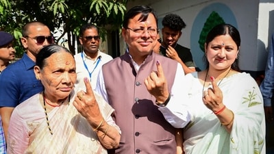 Uttarakhand Chief Minister Pushkar Singh Dhami and his family members show their ink-marked finger after casting votes for Lok Sabha elections, in Khatima. (PTI) Uttarakhand Chief Minister Pushkar Singh Dhami and his family members show their ink-marked finger after casting votes for Lok Sabha elections, in Khatima. (PTI)