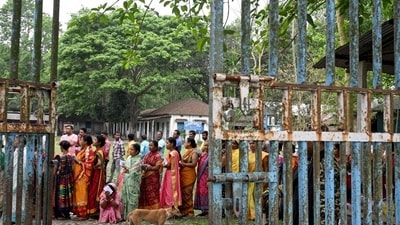 People outside a polling booth in West Bengal’s Cooch Behar. (AFP) People outside a polling booth in West Bengal’s Cooch Behar. (AFP)