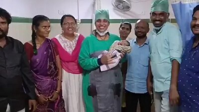 TDP's Gottipati Lakshmi with the woman's family and the latter's newborn (twitter.com/IamDrLakshmiG) TDP's Gottipati Lakshmi with the woman's family and the latter's newborn (twitter.com/IamDrLakshmiG)