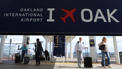 OAKLAND, CALIFORNIA - APRIL 12: Travelers walk towards Terminal 2 at Oakland International Airport on April 12, 2024 in Oakland, California. (Getty Images via AFP) OAKLAND, CALIFORNIA - APRIL 12: Travelers walk towards Terminal 2 at Oakland International Airport on April 12, 2024 in Oakland, California. (Getty Images via AFP)