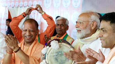 Uttar Pradesh chief minister Yogi Adityanath at the Amroha rally with Prime Minister Narendra Modi on Friday. (ANI PHOTO)