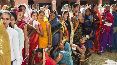 Voters wait to cast their ballot in Aurangabad, Bihar on Friday. (PTI Photo) Voters wait to cast their ballot in Aurangabad, Bihar on Friday. (PTI Photo)
