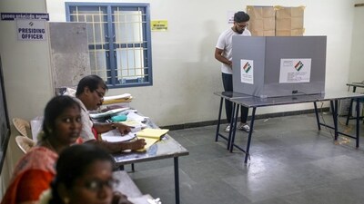 A voter casts a ballot at a polling station during the first phase of voting for national elections in Chennai, Tamil Nadu on April 19. (Bloomberg)