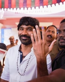 Dhanush beams at the camera after voting