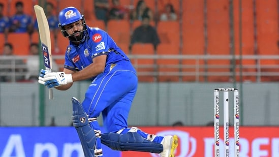 Mumbai Indians' Rohit Sharma watches the ball after playing a shot. (AFP)