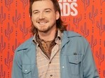 Morgan Wallen was arrested after police say he threw a chair off the rooftop of a newly opened six-story bar in downtown Nashville. 