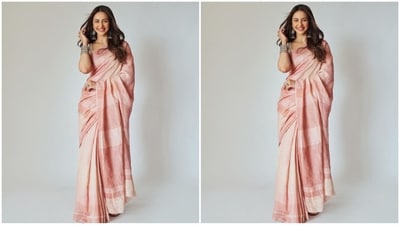 Her saree is in an ethereal two-tone pink and she wrapped it elegantly around her, letting the pallu fall gracefully from her shoulders. She paired it with a silver sleeveless blouse that perfectly complemented her glam saree look. (Instagram/@rakulpreet) Her saree is in an ethereal two-tone pink and she wrapped it elegantly around her, letting the pallu fall gracefully from her shoulders. She paired it with a silver sleeveless blouse that perfectly complemented her glam saree look. (Instagram/@rakulpreet)