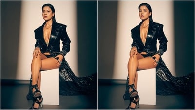 Her outfit is from the shelves of the fashion brand Helen Anthony and consists of a full sleeved black leather jacket with an open deep v-neck, power shoulders, full sleeves, double collar, shiny leather fabric and an attached floor-sweeping net fabric adorned with crystals. (Instagram/@shehnaazgill) Her outfit is from the shelves of the fashion brand Helen Anthony and consists of a full sleeved black leather jacket with an open deep v-neck, power shoulders, full sleeves, double collar, shiny leather fabric and an attached floor-sweeping net fabric adorned with crystals. (Instagram/@shehnaazgill)