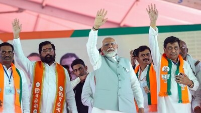Nanded, Apr 20 (ANI): Prime Minister Narendra Modi waves to the crowd during a public gathering in Nanded, Maharashtra on Saturday. Maharashtra Chief Minister Eknath Shinde and BJP MP Ashok Chavan also seen. (ANI Photo) (BJP media) Nanded, Apr 20 (ANI): Prime Minister Narendra Modi waves to the crowd during a public gathering in Nanded, Maharashtra on Saturday. Maharashtra Chief Minister Eknath Shinde and BJP MP Ashok Chavan also seen. (ANI Photo) (BJP media)