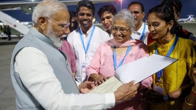 PM Narendra Modi meets Usha Krishna, who is visually impaired, at the airport, in Bengaluru on Saturday. PM Modi presented her with a copy of the book 'A Promised Nation Hon'ble Shri Narendra Modi- the Maker of New India' written in braille. (X/@narendramodi) PM Narendra Modi meets Usha Krishna, who is visually impaired, at the airport, in Bengaluru on Saturday. PM Modi presented her with a copy of the book 'A Promised Nation Hon'ble Shri Narendra Modi- the Maker of New India' written in braille. (X/@narendramodi)