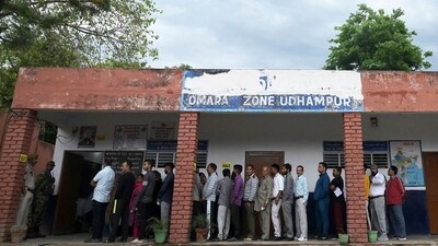 People stand in a queue to cast their votes at a polling station as voting starts in the first phase of India's general election at Udhampur district. (AFP) People stand in a queue to cast their votes at a polling station as voting starts in the first phase of India's general election at Udhampur district. (AFP)