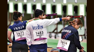 India’s Manu Bhaker and Saurabh Chaudhary with Bomi Kim of Korea, during the 10m air pistol mixed-team qualification round at the Tokyo Olympics. (Getty Images) India’s Manu Bhaker and Saurabh Chaudhary with Bomi Kim of Korea, during the 10m air pistol mixed-team qualification round at the Tokyo Olympics. (Getty Images)
