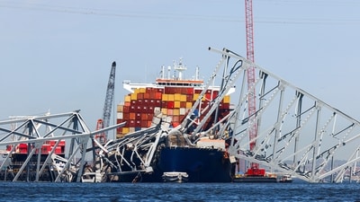 The collapsed Francis Scott Key Bridge lay on top of the container ship Dali, Monday, April 15, 2024, in Baltimore. The FBI confirmed that agents were aboard the Dali conducting court-authorized law enforcement activity. (AP Photo/Julia Nikhinson) (AP) The collapsed Francis Scott Key Bridge lay on top of the container ship Dali, Monday, April 15, 2024, in Baltimore. The FBI confirmed that agents were aboard the Dali conducting court-authorized law enforcement activity. (AP Photo/Julia Nikhinson) (AP)