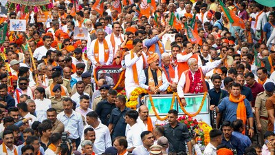 Rajkot: BJP candidate Parshottam Rupala leads a roadshow on his way to filing his nomination papers as BJP candidate for Rajkot Lok Sabha seat, ahead of Lok Sabha elections, in Rajkot, Tuesday, April 16, 2024. (PTI Photo)(PTI04_16_2024_000106A) (PTI) Rajkot: BJP candidate Parshottam Rupala leads a roadshow on his way to filing his nomination papers as BJP candidate for Rajkot Lok Sabha seat, ahead of Lok Sabha elections, in Rajkot, Tuesday, April 16, 2024. (PTI Photo)(PTI04_16_2024_000106A) (PTI)