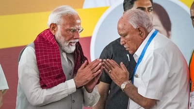 PM Narendra Modi greets former Karnataka chief minister B.S. Yediyurappa during the public meeting for Lok Sabha elections in Bengaluru. (PTI) PM Narendra Modi greets former Karnataka chief minister B.S. Yediyurappa during the public meeting for Lok Sabha elections in Bengaluru. (PTI)