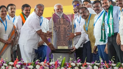 PM Narendra Modi being presented a memento by BJP leaders during a public meeting for Lok Sabha elections, in Bengaluru. (PTI) PM Narendra Modi being presented a memento by BJP leaders during a public meeting for Lok Sabha elections, in Bengaluru. (PTI)