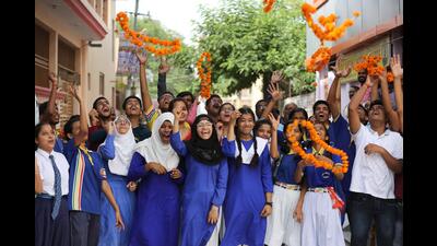 Students celebrate their success in HS and Inter exams, in Lucknow, on Saturday. (HT Photo) Students celebrate their success in HS and Inter exams, in Lucknow, on Saturday. (HT Photo)