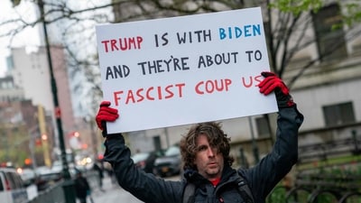 NEW YORK, NEW YORK - APRIL 18: Max Azzarello protests outside of the Manhattan courthouse where former U.S. President Donald Trump's hush money trial is underway on April 18, 2024 in New York City. Former President Trump faces 34 felony counts of falsifying business records in the first of his criminal cases to go to trial. David Dee Delgado/Getty Images/AFP (Photo by David Dee Delgado / GETTY IMAGES NORTH AMERICA / Getty Images via AFP) (Getty Images via AFP) NEW YORK, NEW YORK - APRIL 18: Max Azzarello protests outside of the Manhattan courthouse where former U.S. President Donald Trump's hush money trial is underway on April 18, 2024 in New York City. Former President Trump faces 34 felony counts of falsifying business records in the first of his criminal cases to go to trial. David Dee Delgado/Getty Images/AFP (Photo by David Dee Delgado / GETTY IMAGES NORTH AMERICA / Getty Images via AFP) (Getty Images via AFP)