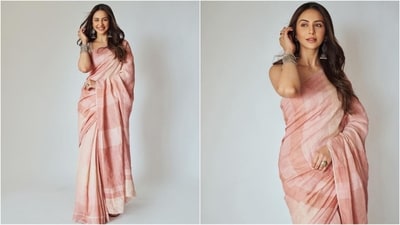 Rakul Preet Singh is here to give you some stunning ethnic fashion inspiration with her latest look wrapped in a six-yard grace. The newly-wed actress is a total stunner who continues to hit fashion targets like a pro. Whether it's a mini dress or a red carpet-worthy gown, the stylish diva can pull off any look to perfection. Rakul is quite active on social media and her glam Insta-diaries filled with fashion-forward looks are a treasure trove of style inspiration for all her followers. Her latest blush pink saree look is no exception and is sure to inspire your wardrobe. (Instagram/@rakulpreet) Rakul Preet Singh is here to give you some stunning ethnic fashion inspiration with her latest look wrapped in a six-yard grace. The newly-wed actress is a total stunner who continues to hit fashion targets like a pro. Whether it's a mini dress or a red carpet-worthy gown, the stylish diva can pull off any look to perfection. Rakul is quite active on social media and her glam Insta-diaries filled with fashion-forward looks are a treasure trove of style inspiration for all her followers. Her latest blush pink saree look is no exception and is sure to inspire your wardrobe. (Instagram/@rakulpreet)