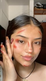 Strategically place the red lipstick around your face (Instagram) Strategically place the red lipstick around your face (Instagram)