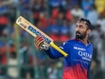 Royal Challengers Bengaluru's Dinesh Karthik greets spectators as he walks back to the pavilion Royal Challengers Bengaluru's Dinesh Karthik greets spectators as he walks back to the pavilion