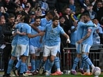 Manchester City's Portuguese midfielder #20 Bernardo Silva (3L) celebrates with teammates after scoring the opening goal of the English FA Cup semi-final football match between Manchester City and Chelsea Manchester City's Portuguese midfielder #20 Bernardo Silva (3L) celebrates with teammates after scoring the opening goal of the English FA Cup semi-final football match between Manchester City and Chelsea