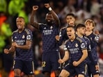 Real Madrid players react during a penalty shootout