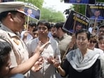 AAP leader Atishi with party workers carrying insulin injections stage a protest at gate number 4 of Tihar Jail in New Delhi on Sunday. (Vipin Kumar/HT Photo)