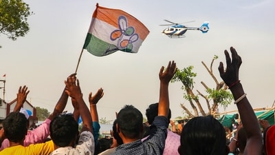 Supporters of All India Trinamool Congress (AITC) wave at West Bengal CM and TMC Chief Mamata Banerjee's helicopter at a public meeting in South Dinajpur, West Bengal. (PTI) Supporters of All India Trinamool Congress (AITC) wave at West Bengal CM and TMC Chief Mamata Banerjee's helicopter at a public meeting in South Dinajpur, West Bengal. (PTI)