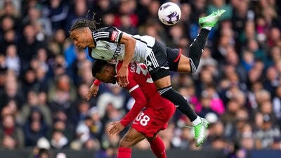 Fulham's Bobby Decordova-Reid, top, duels for the ball with Liverpool's Ryan Gravenberch. (AP) Fulham's Bobby Decordova-Reid, top, duels for the ball with Liverpool's Ryan Gravenberch. (AP)