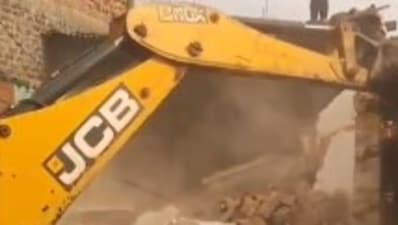 Bulldozer demolishing the accused's "illegally-built" home (Image courtesy: X/Anshul Saxena)