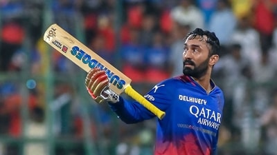 Royal Challengers Bengaluru's Dinesh Karthik greets spectators as he walks back to the pavilion (AFP) Royal Challengers Bengaluru's Dinesh Karthik greets spectators as he walks back to the pavilion (AFP)
