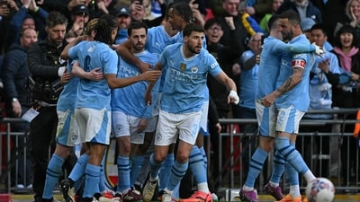 Manchester City's Portuguese midfielder #20 Bernardo Silva (3L) celebrates with teammates after scoring the opening goal of the English FA Cup semi-final football match between Manchester City and Chelsea (AFP) Manchester City's Portuguese midfielder #20 Bernardo Silva (3L) celebrates with teammates after scoring the opening goal of the English FA Cup semi-final football match between Manchester City and Chelsea (AFP)