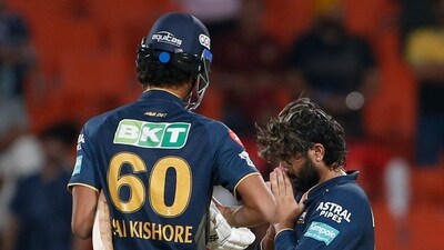 Gujarat Titans' Rahul Tewatia , right, and his batting partner Sai Kishore celebrate their team's win over Punjab Kings (AP)