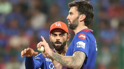 Royal Challengers Bengaluru's Virat Kohli speaks to bowler Reece Topley (AP) Royal Challengers Bengaluru's Virat Kohli speaks to bowler Reece Topley (AP)