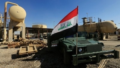 An Iraqi flag is seen on a military vehicle at an oil field in Kirkuk. Control of the border areas is of crucial for the landlocked Kurdish region. An oil pipeline runs from northern Iraq into Turkey, carrying crude exports which were the principal source of funds for the Kurds. Since mid-October, Iraqi forces have reclaimed the oil-rich province of Kirkuk dealing a severe blow to Barzani’s ambitions of Kurdish statehood. (Alaa Al-Marjani / REUTERS)