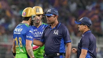 Kolkata: Royal Challengers Bengaluru's Virat Kohli with captain Faf du Plessis interacts with the Umpires after he was caught and bowled by Kolkata Knight Riders' Harshit Rana (PTI) Kolkata: Royal Challengers Bengaluru's Virat Kohli with captain Faf du Plessis interacts with the Umpires after he was caught and bowled by Kolkata Knight Riders' Harshit Rana (PTI)