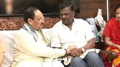BJP president JP Nadda with Niranjan Hiremath. (ANI) BJP president JP Nadda with Niranjan Hiremath. (ANI)