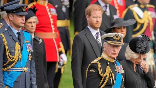 FILE - King Charles III, front right, Camilla, the Queen Consort, Prince Harry and Prince William watch as the coffin of Queen Elizabeth II is placed into the hearse following the state funeral service in Westminster Abbey in central London Monday Sept. 19, 2022. King Charles III has been diagnosed with a form of cancer and has begun treatment, Buckingham Palace says on Monday, Feb. 5, 2024. (AP Photo/Martin Meissner, Pool, File) (AP)
