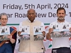 FILE- India’s opposition Congress party leaders from left, Sonia Gandhi, Mallikarjun Kharge, and Rahul Gandhi, display copies of party’s election manifesto during a press conference in New Delhi, India, April 5, 2024. India's 6-week-long general election starts on April 19 and results will be announced on June 4. (AP Photo/Manish Swarup, File)