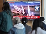 People watch a television screen showing a news broadcast with file footage of a North Korean missile test, at a railway station in Seoul on April 22, 2024. People watch a television screen showing a news broadcast with file footage of a North Korean missile test, at a railway station in Seoul on April 22, 2024.