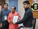 Surat: BJP leader Mukesh Dalal receives the 'certificate of election' after he was elected unopposed from Surat Lok Sabha seat, in Surat, Monday, April 22, 2024.(PTI)