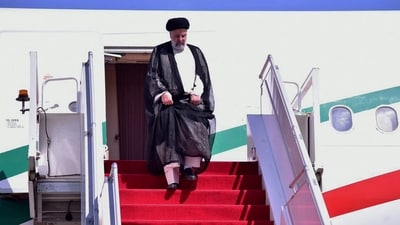 Iranian President Ebrahim Raisi gets down from a plane upon his arrival in Islamabad, Pakistan on Monday. (AP) Iranian President Ebrahim Raisi gets down from a plane upon his arrival in Islamabad, Pakistan on Monday. (AP)