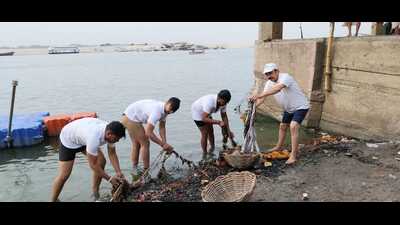 Activists removing polythene from Manikarnika Ghat stretch in Varanasi. (HT)