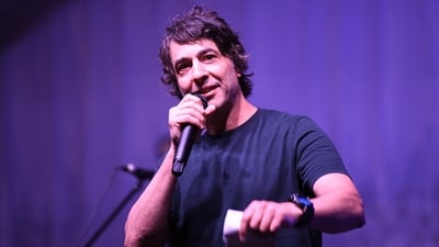 In response to the criticism, Arj Barker stated that the baby was interfering with his performance and that the program was explicitly advertised as being "strictly age 15+". (Getty Images) In response to the criticism, Arj Barker stated that the baby was interfering with his performance and that the program was explicitly advertised as being "strictly age 15+". (Getty Images)