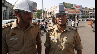 Cops wearing AC helmets during a trial run conducted at Hazratganj in Lucknow on Monday. (Deepak Gupta/HT Photo) Cops wearing AC helmets during a trial run conducted at Hazratganj in Lucknow on Monday. (Deepak Gupta/HT Photo)