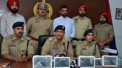 Dera Bassi police officials with the recovered weapons on Monday. (HT photo) Dera Bassi police officials with the recovered weapons on Monday. (HT photo)