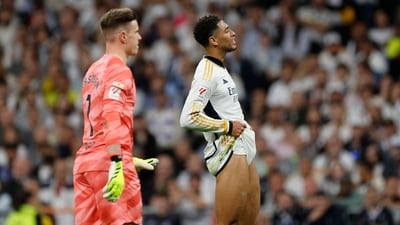 Real Madrid's English midfielder ude Bellingham (R) reacts during the match against Barcelona. (AFP) Real Madrid's English midfielder ude Bellingham (R) reacts during the match against Barcelona. (AFP)