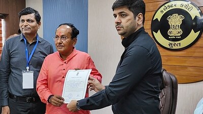 BJP leader Mukesh Dalal receives the 'certificate of election' after he was elected unopposed from Surat Lok Sabha seat in Surat on April 22. (PTI) BJP leader Mukesh Dalal receives the 'certificate of election' after he was elected unopposed from Surat Lok Sabha seat in Surat on April 22. (PTI)